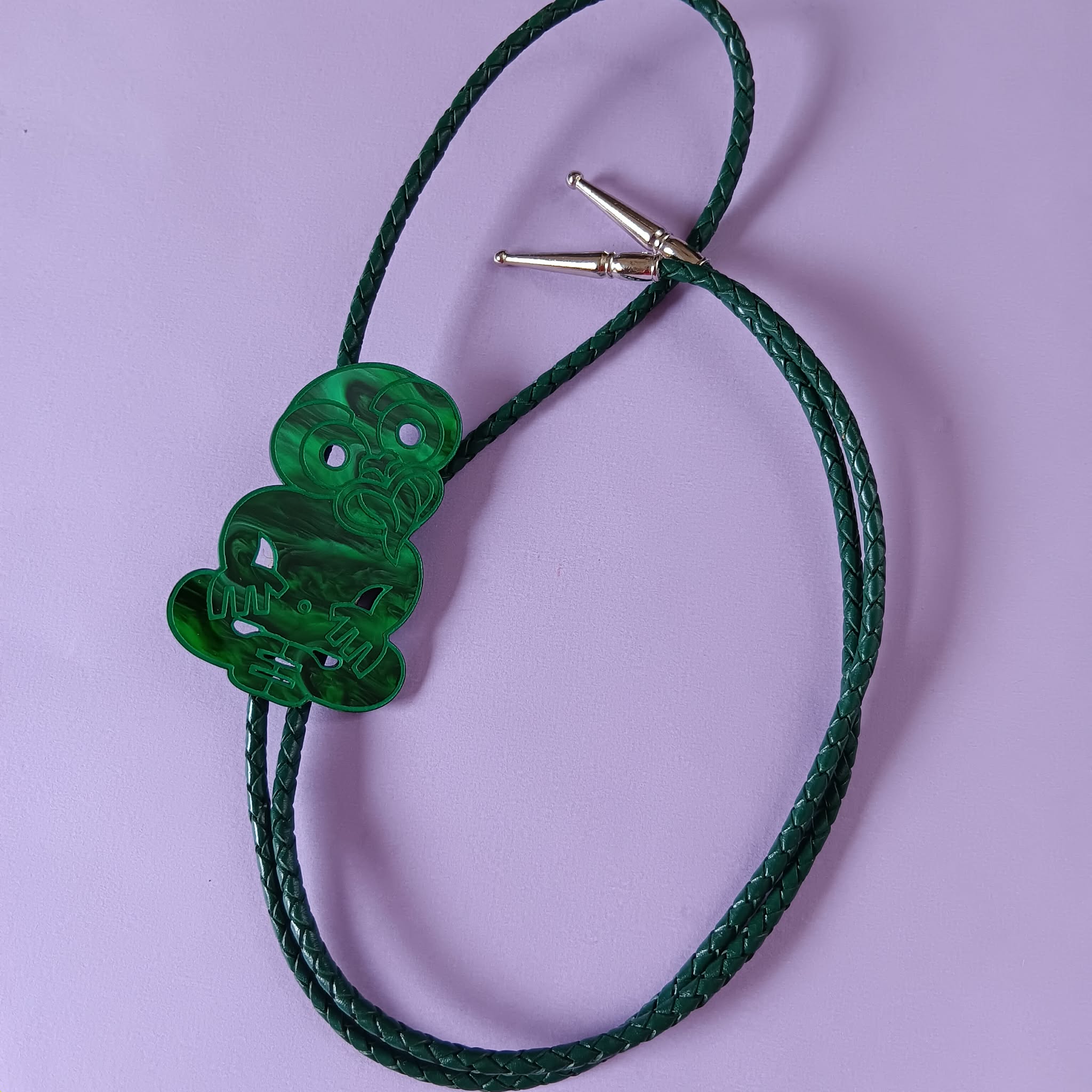 TIKI BOLO TIE - GREEN LEATHER CORD